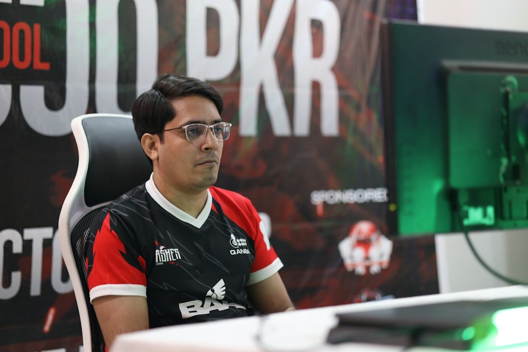 Professional esports player with intense focus during competitive gaming match showing concentration and quick reflexes